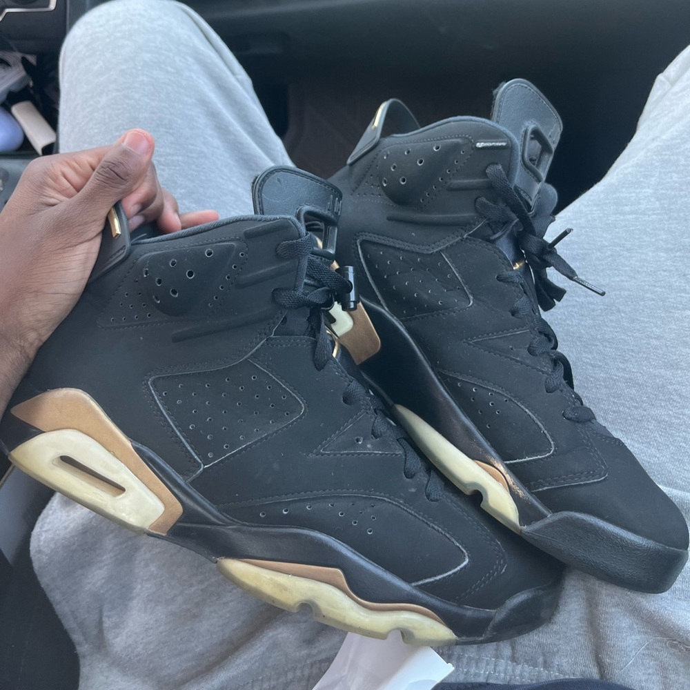 Jordan Black and Gold Sneakers